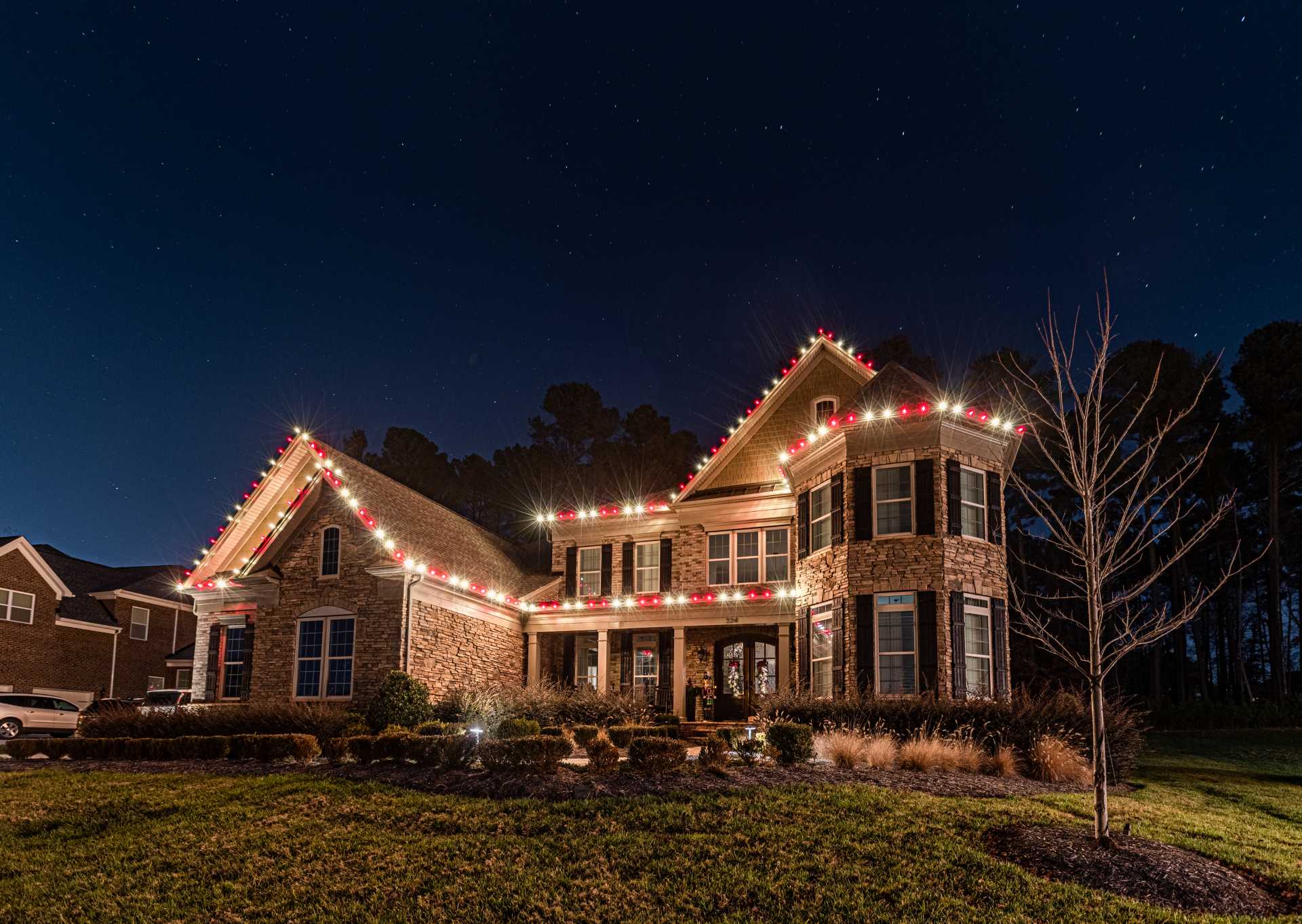 Fulton County holiday light installation on a large residential home
