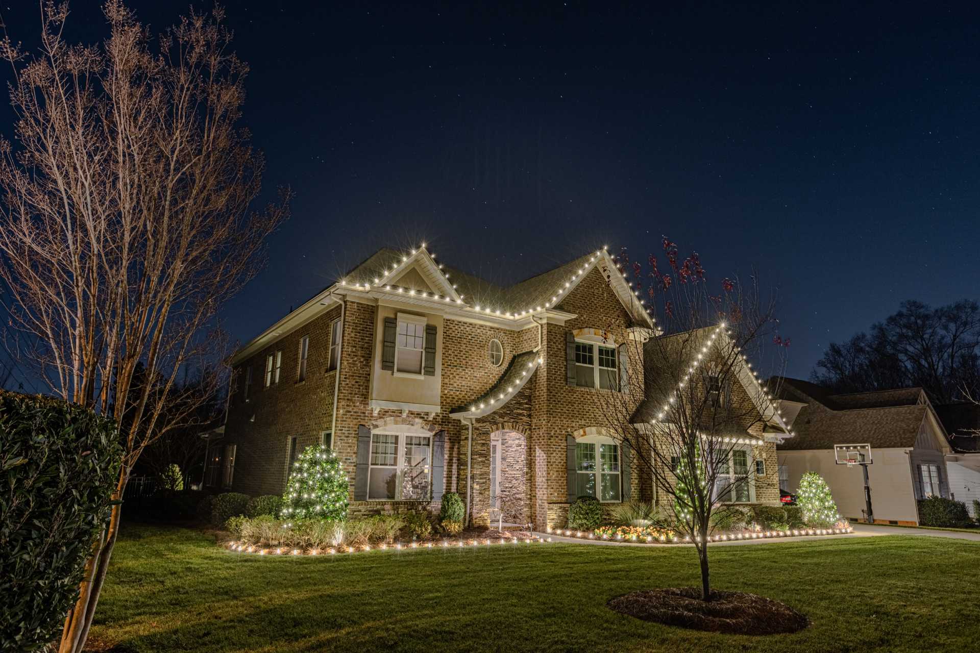 Holiday light installation on a residential home